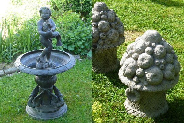 Bild eines metallbrunnens mit Ornamenten: Putte mit Fisch, Steinvasen mit Früchten